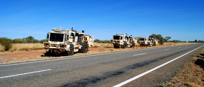 Vibroseis trucks alongside the Barkly Highway, Queensland, working on the South Nicholson Basin seismic line.