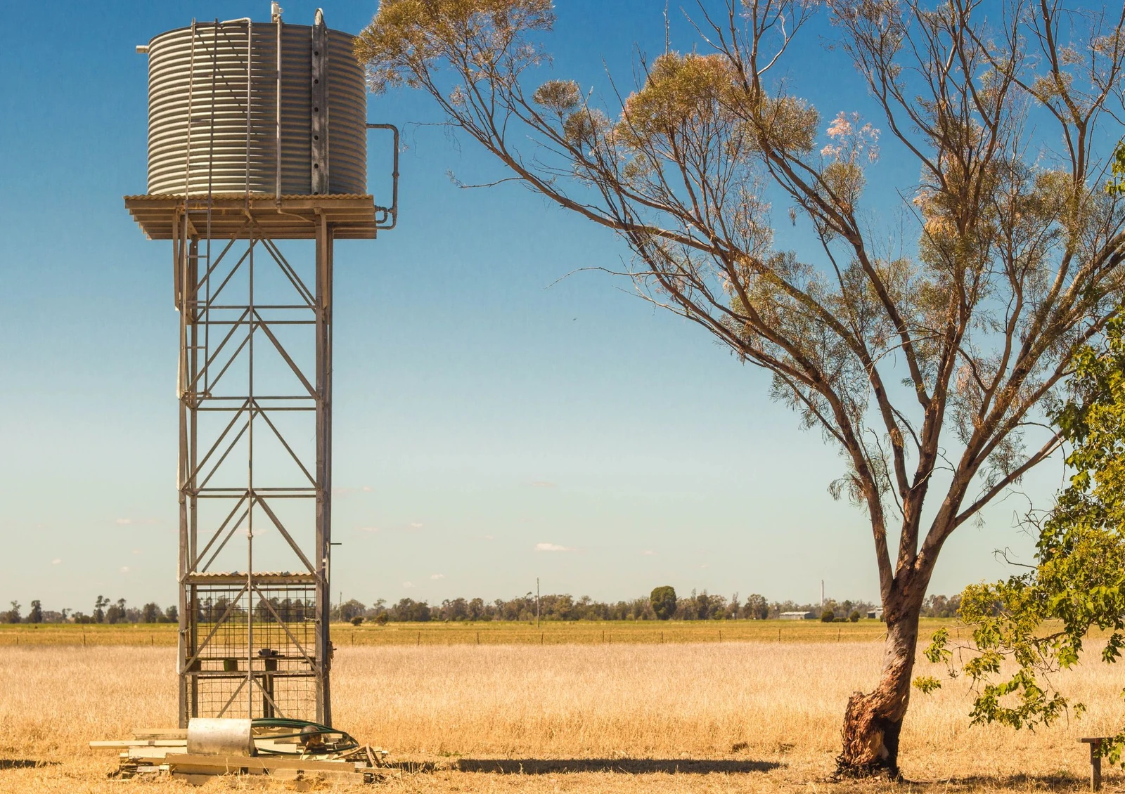 Image of water tank in a dry golden landscape